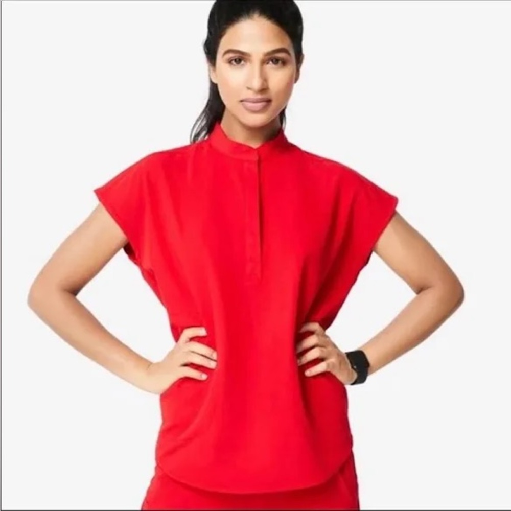 FIGS. Women’s Rafaela oversized scrub top. In limited edition color Winning Red